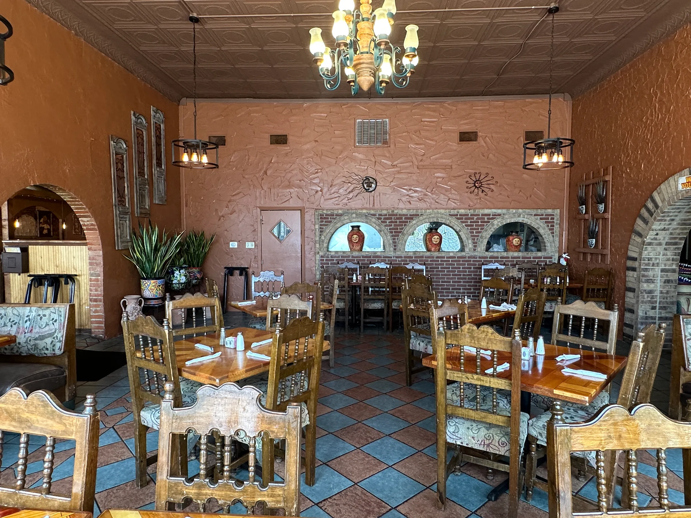 Rustic second dining room at Los Mariachis Tex-Mex with chandelier 